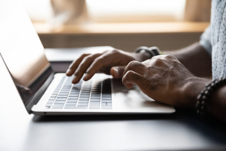 An individuals hands typing away on a laptop. Representing how our interesting continuing education for therapists can be done online! Read our blog to find out more.