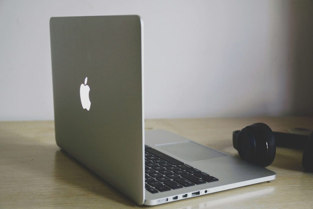 A laptop & headphones sitting on a table. Want to learn more about CE credits? Get started with our online continuing education for therapists today.