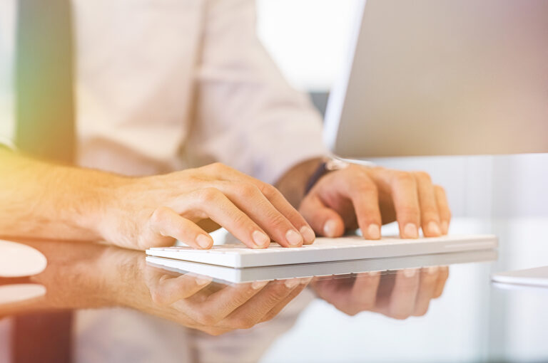 An individual typing away on a keyboard. Did you know our online CE courses can be done from the comfort of your couch? Read our blog for more insights on how counselors & therapists can renew their license in Texas.